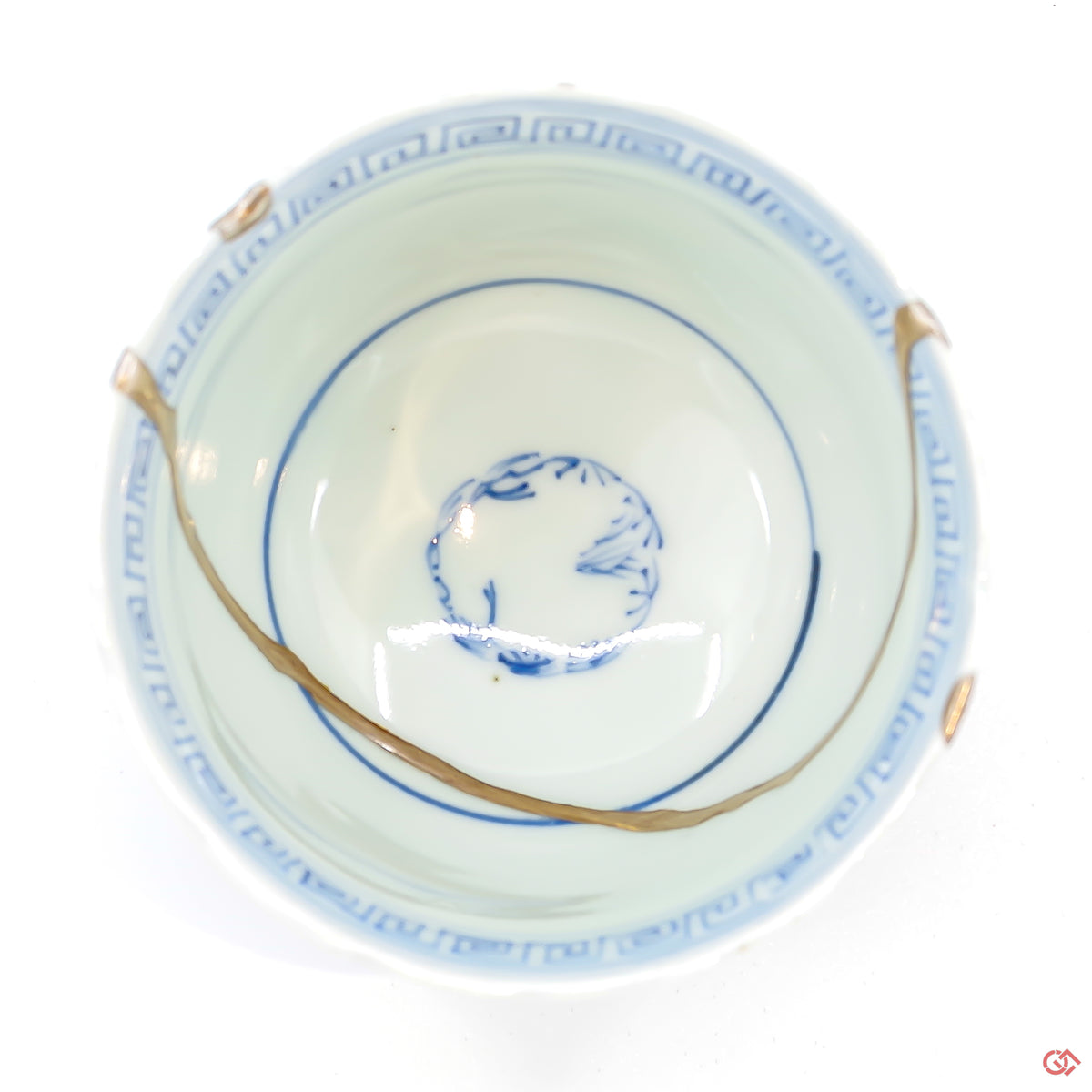A photo of the top of an authentic Kintsugi pottery piece, showing its overall design and features.