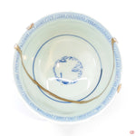A photo of the top of an authentic Kintsugi pottery piece, showing its overall design and features.