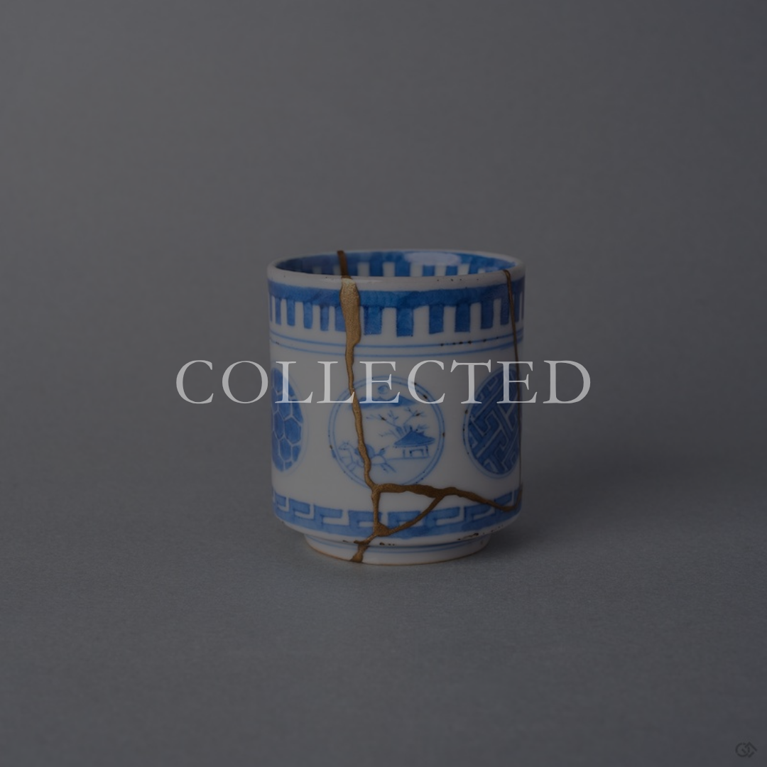 Kintsugi sake cup in Ko-Imari sometsuke porcelain with painted round windows, restored with natural urushi and 24K gold, front view. Collected.