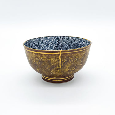 Authentic kintsugi sake cup Mon Pattern with traditional crest design and 24K gold repair — elegant and timeless kintsugi tableware, praised by a returning customer from Texas.