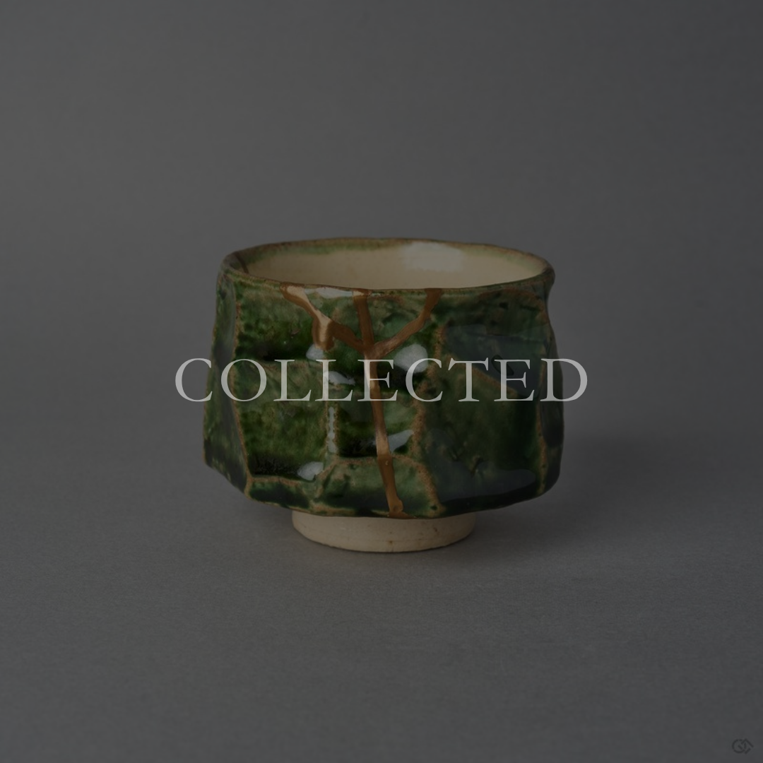 Kintsugi sake cup in faceted Oribe green pottery with an ivory well, restored with natural urushi and 24K gold, front view. Collected.