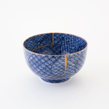 Authentic kintsugi sake cup Shonzui Mon Pattern with traditional blue and white design and 24K gold repair — a beautiful piece with an inspiring business model, praised by a returning customer from Washington.