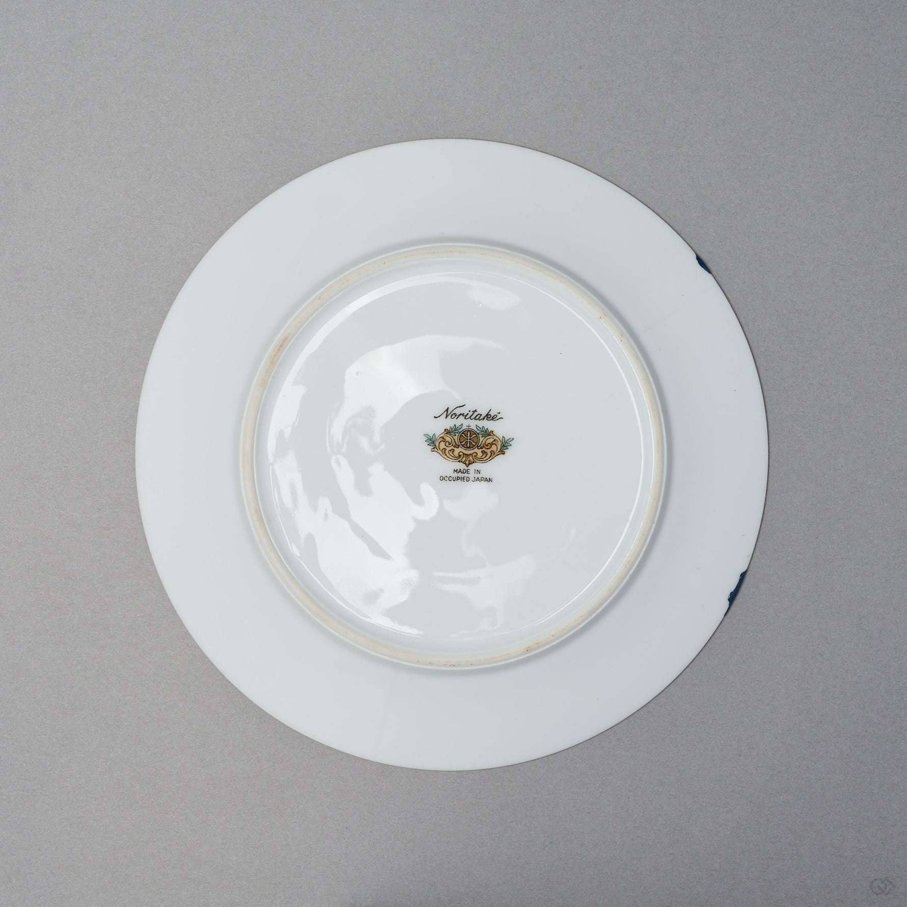 Kintsugi tea cup and saucer, Early Noritake saucer underside with backstamp; restored in natural urushi, 24K gold on the cup, blue urushi at the rim.