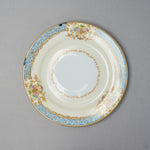 Kintsugi tea cup set saucer in Early Noritake porcelain, seen from above: two rim chips restored in blue natural urushi by the turquoise border.