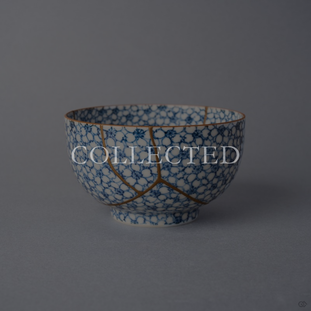 Kintsugi tea cup in Kyoto ware covered in sometsuke cherry blossoms, restored with natural urushi and 24K gold, front view. Collected.