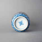 Kintsugi tea cup base with foot ring and underglaze blue maker's mark; no restoration is visible in this view, bottom angle.
