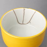 Interior close-up of the seams: silver kintsugi glows, creating a powerful sense of restorative beauty as the vessel is mended.