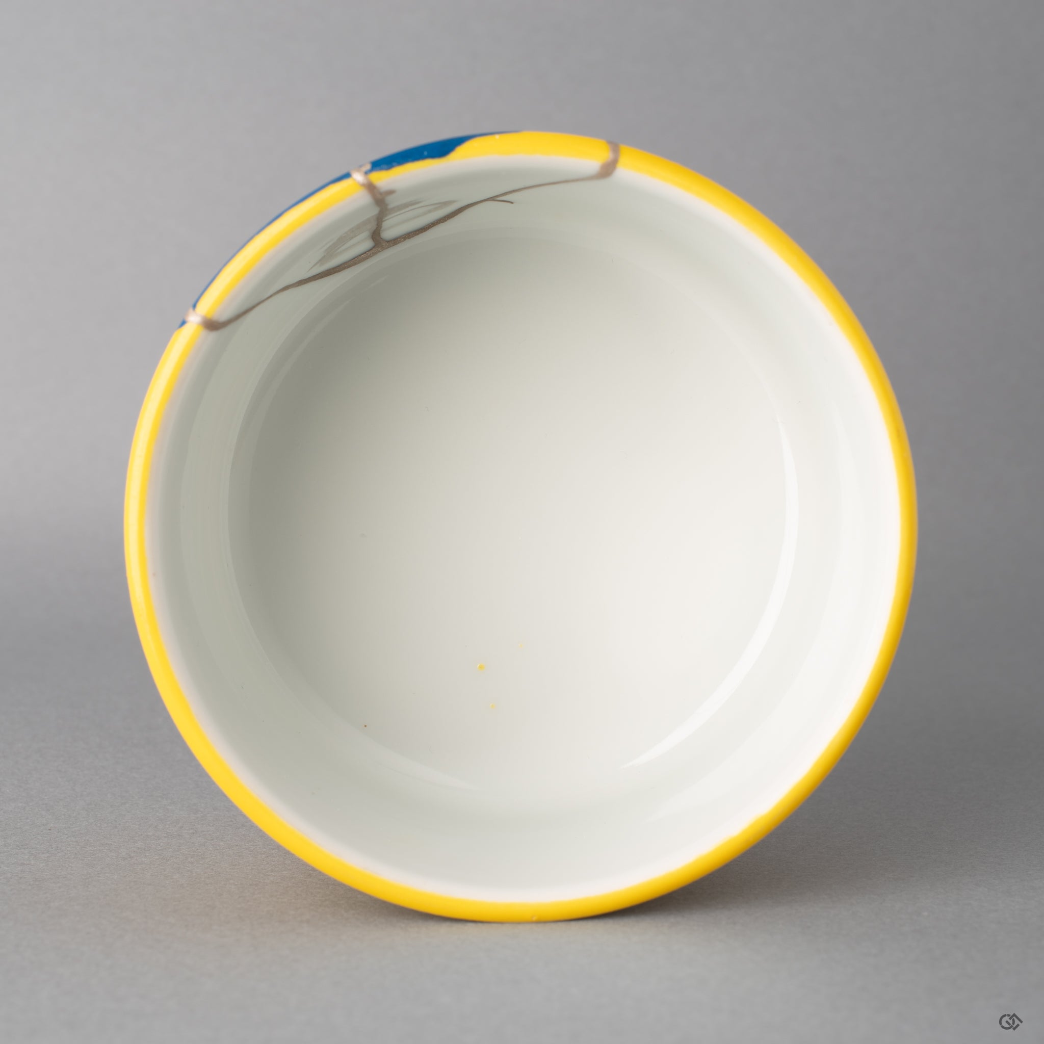 Looking down, pure silver kintsugi seams cross the rim, showing the vessel's spiritual elegance. This master-repaired art is for sale.