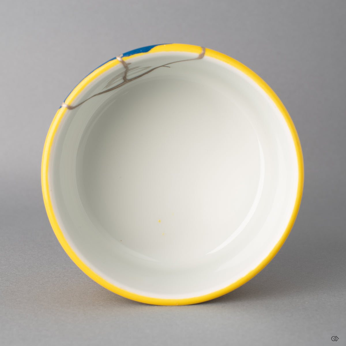 Looking down, pure silver kintsugi seams cross the rim, showing the vessel's spiritual elegance. This master-repaired art is for sale.