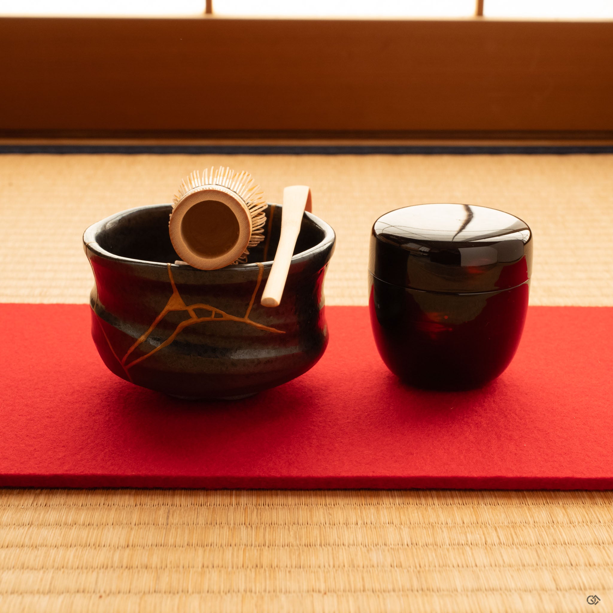 Kintsugi Arita matcha bowl on a tatami mat, gold seams catching soft light, embodying mindful luxury in a traditional Japanese setting.