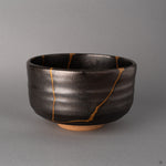 Bold 24K gold kintsugi seams mark this angle of the Arita bowl, each line tracing fracture with living philosophy.