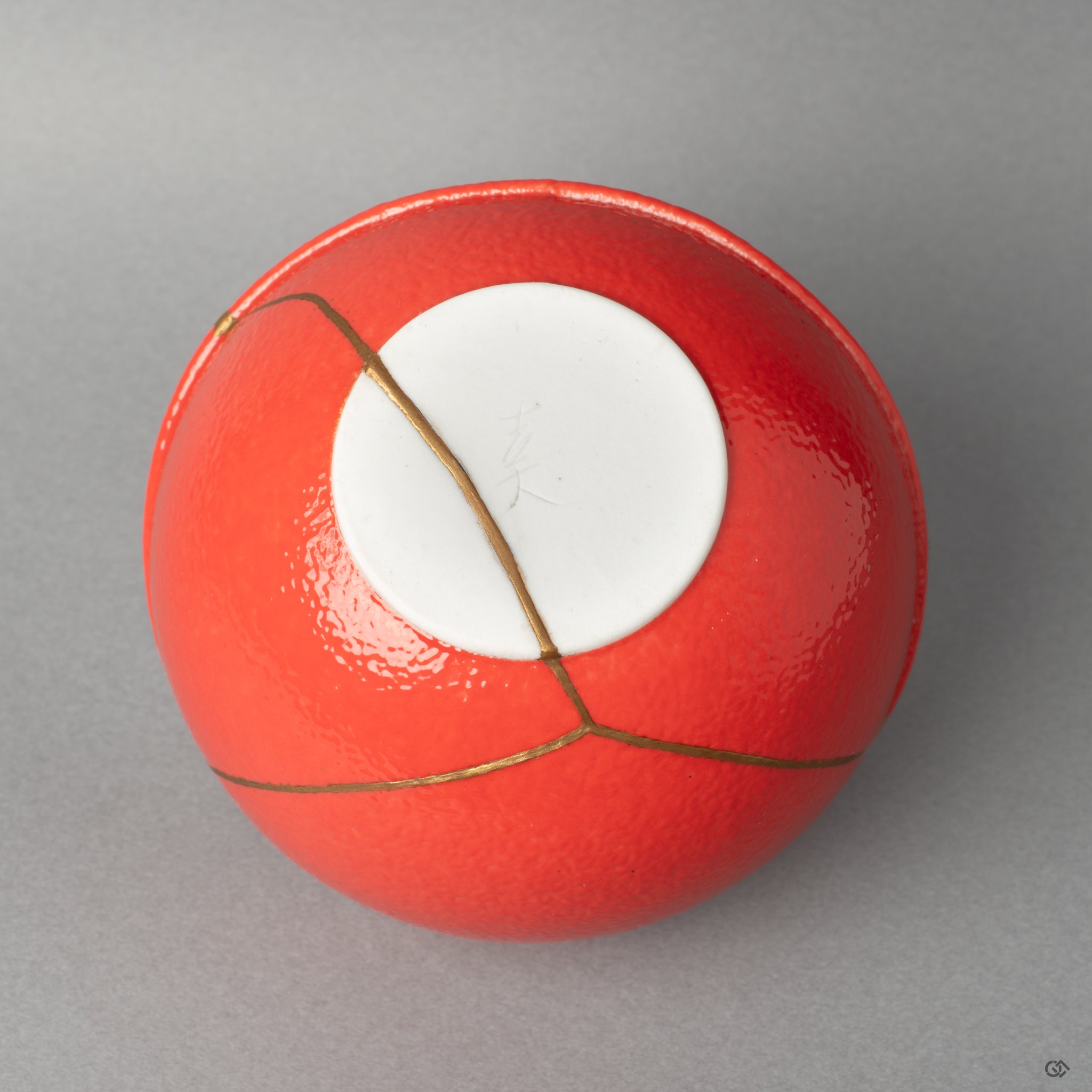 The base of this Arita vessel, where the kintsugi ends, showing how restoration makes history made visible through careful craft.