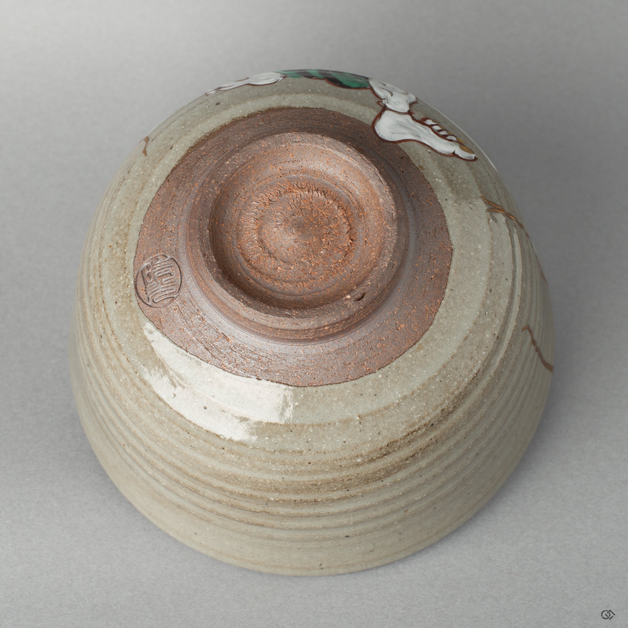 Underside of the Kyoto bowl showing the artist’s mark. The gold kintsugi lines trace the story in every seam of the pottery.