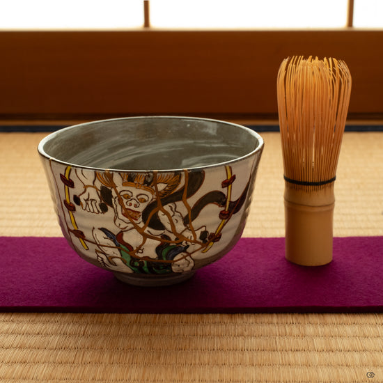 Kintsugi bowl set on a tatami mat in soft light. This legacy piece encourages an intentional living that honors heritage.