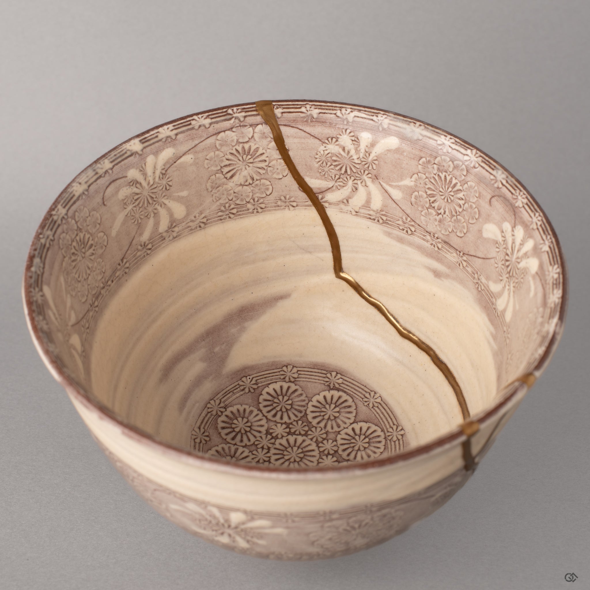 Looking into the Kyoto matcha bowl, kintsugi lines in 24K gold trace toward the center, cultural heritage mapped in each mended path.