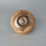 The dark glazed foot of the kintsugi matcha bowl, turned and trimmed by hand, honoring history in its base.
