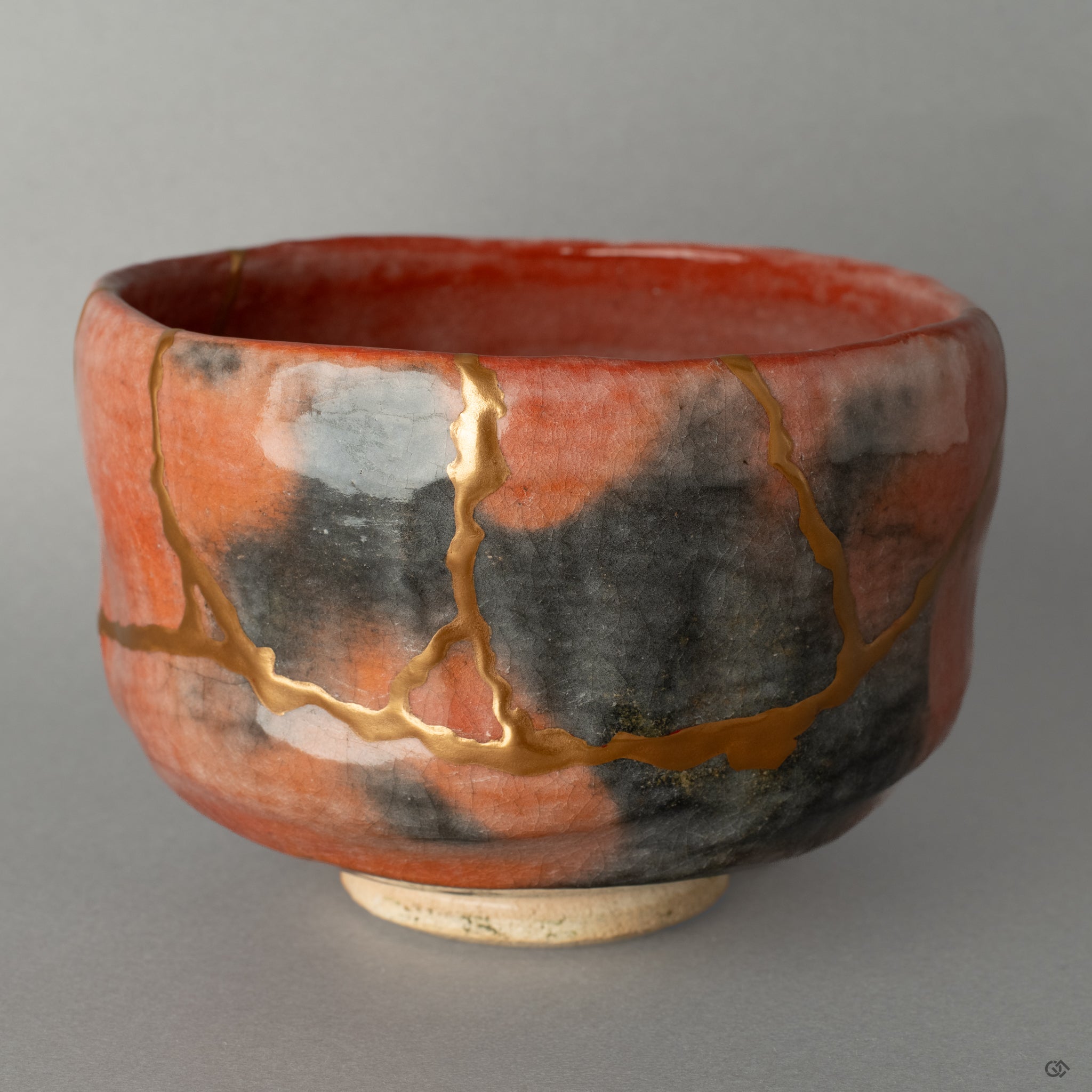 Full view of a Kyoto ware matcha bowl, mended with authentic 24k gold kintsugi, a perfect embodiment of wabi-sabi and its quiet beauty.