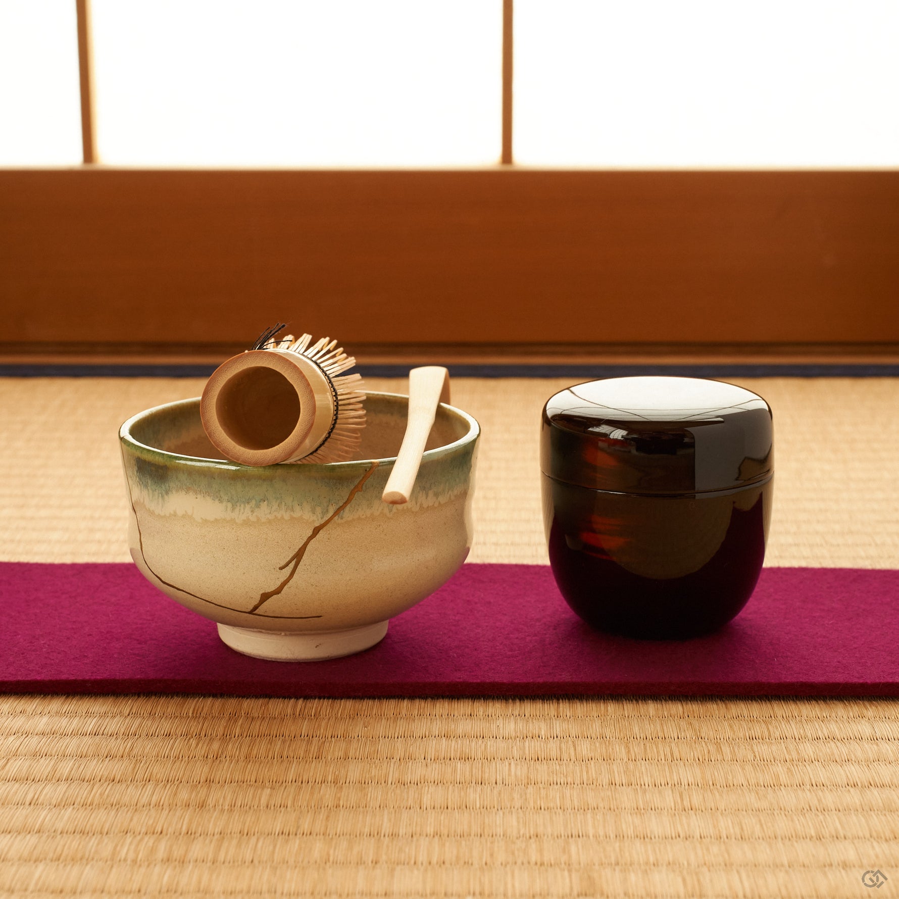 Set on tatami for a quiet tea moment, this kintsugi matcha bowl gathers soft light along its gold seam, a vessel for intentional living.