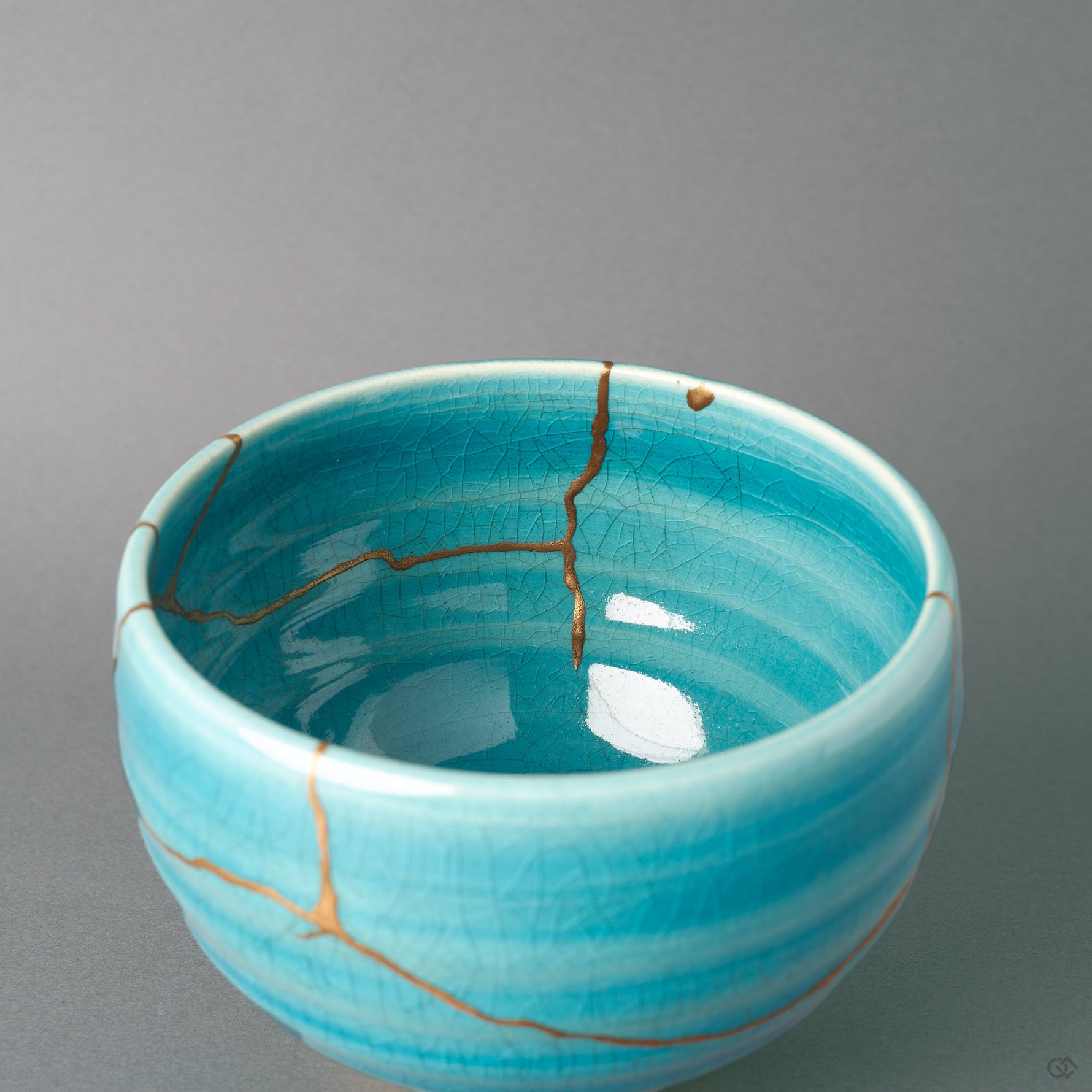 The interior glaze of this kintsugi matcha bowl carries kannyu crazing and a gold seam, a soulful object viewed from within.