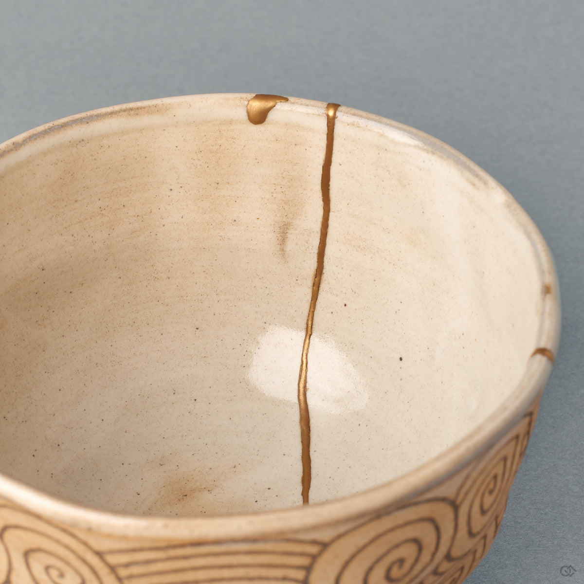 A closer look into the kintsugi matcha bowl shows where the gold seam meets the rim, beauty in imperfection made visible.