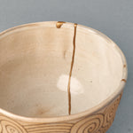 A closer look into the kintsugi matcha bowl shows where the gold seam meets the rim, beauty in imperfection made visible.