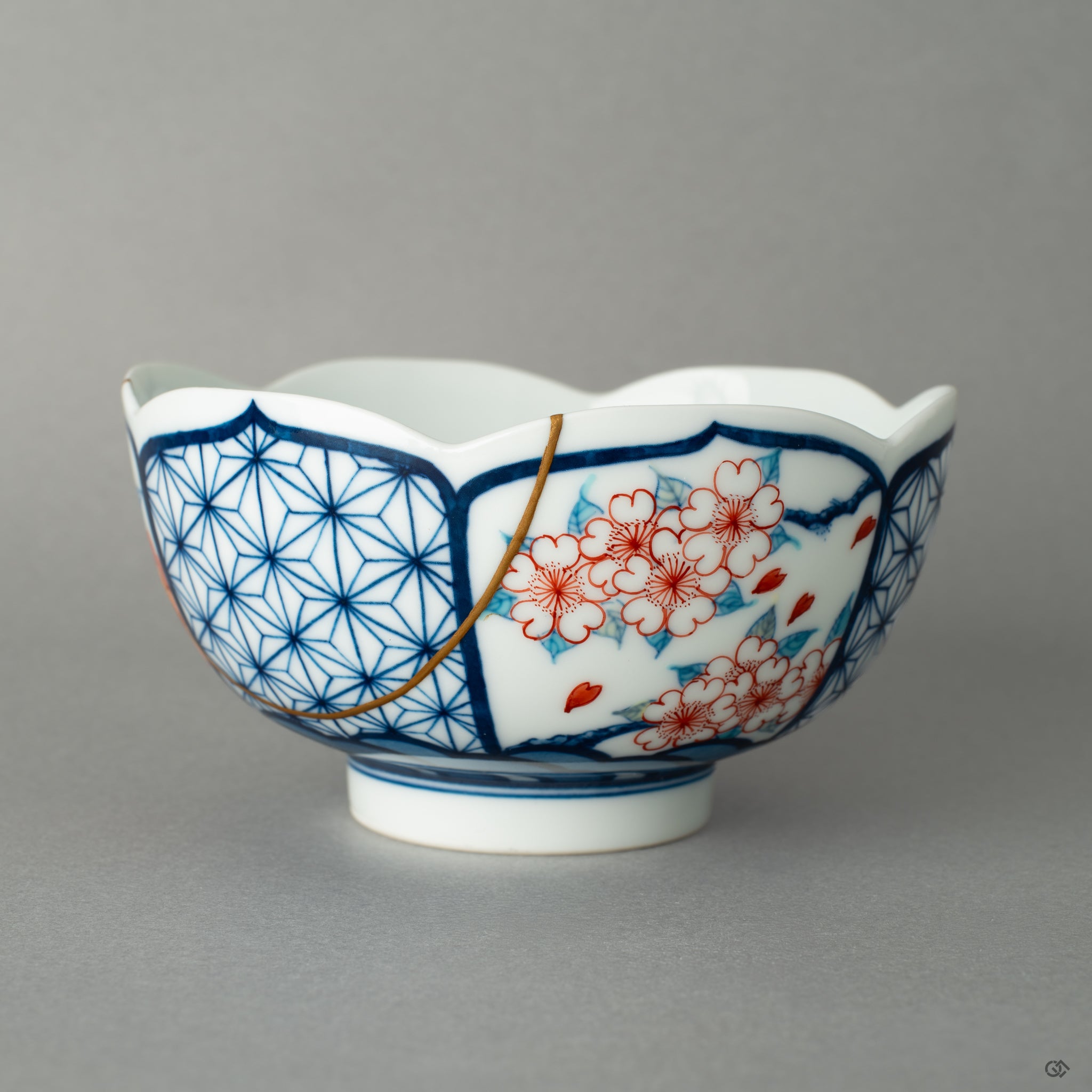 Front view of a Nabeshima matcha bowl restored with 24k gold kintsugi, revealing the quiet beauty of centuries-old tradition.