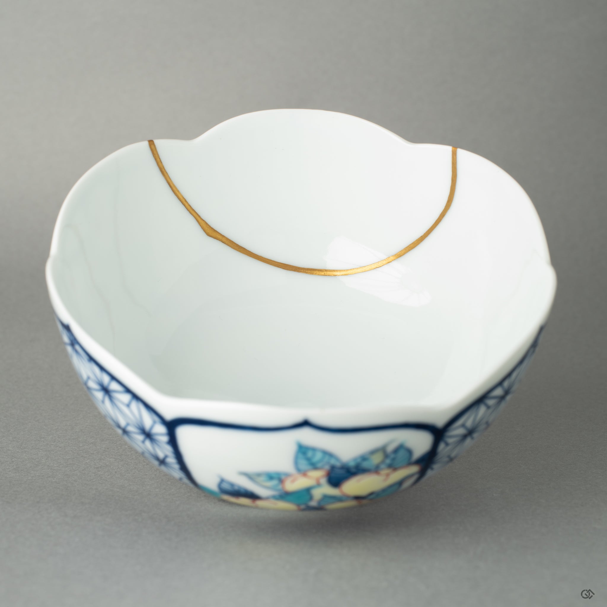 Interior close-up of golden kintsugi lines across Nabeshima bowl, capturing the tactile history of mindful repair.