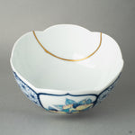 Interior close-up of golden kintsugi lines across Nabeshima bowl, capturing the tactile history of mindful repair.