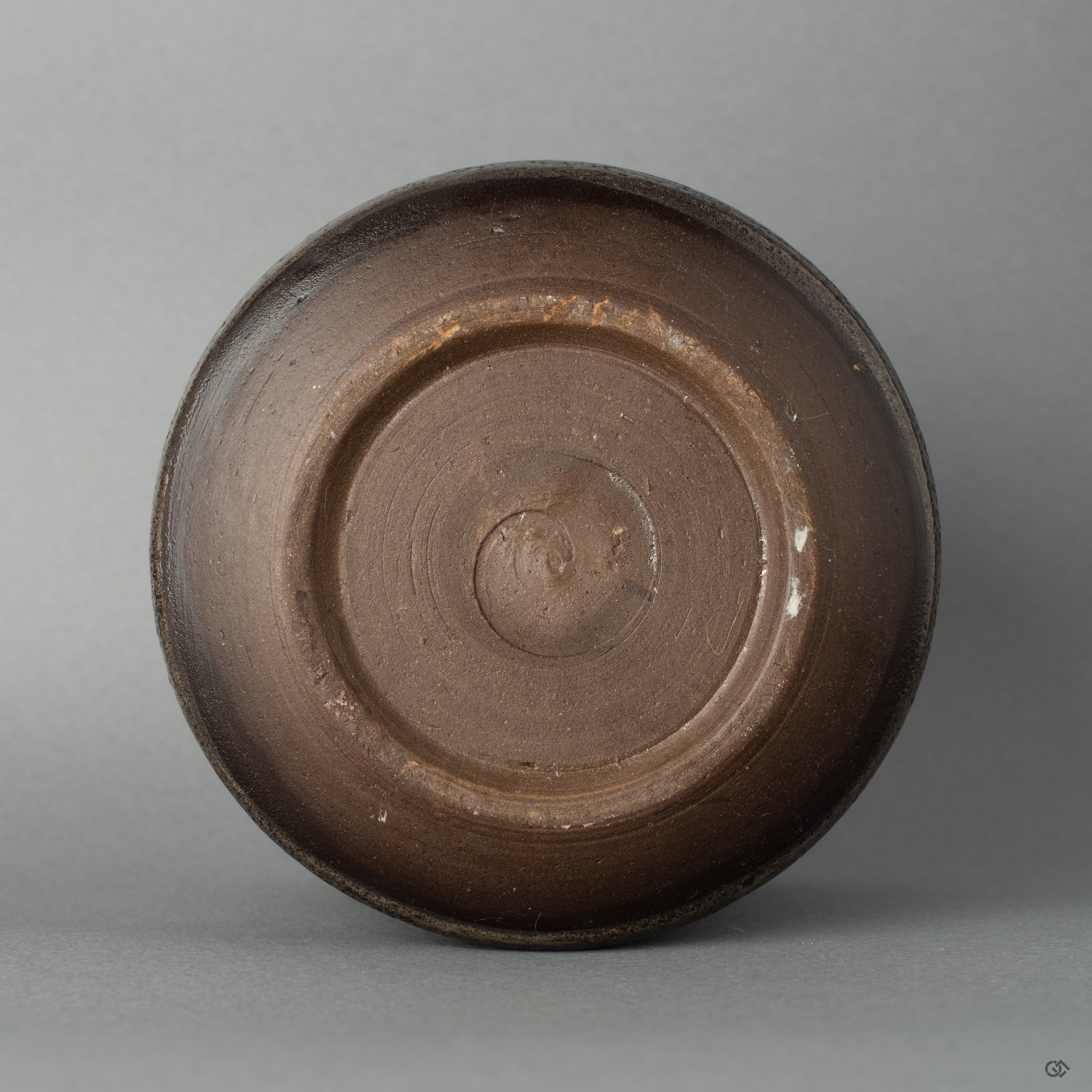Bottom view showing the kintsugi restoration on Shigaraki ware, a museum-worthy object carrying centuries of tradition.