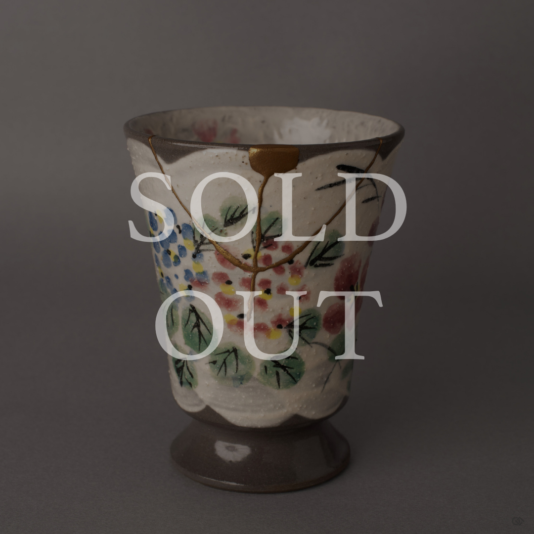 Sold out: 24K gold kintsugi Kyoto ware mug with hand-painted florals, restored with natural urushi lacquer. Food-safe earthenware.