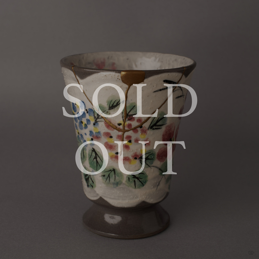 Sold out: 24K gold kintsugi Kyoto ware mug with hand-painted florals, restored with natural urushi lacquer. Food-safe earthenware.