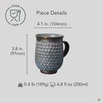 Kyoto ware kintsugi mug in dark clay with white mishima florets and a 24K gold rim restoration, restored with natural urushi, shown with dimensions for scale reference.