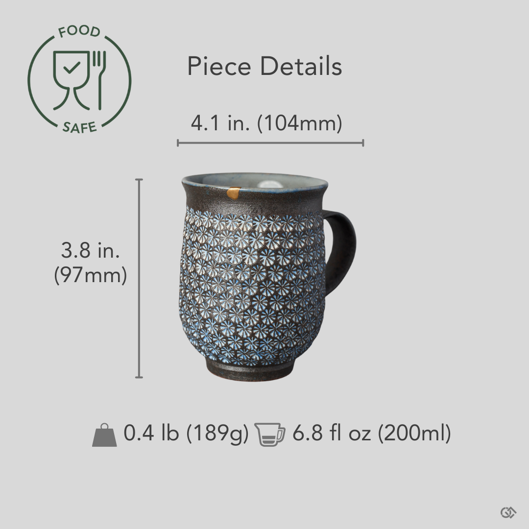 Kyoto ware kintsugi mug in dark clay with white mishima florets and a 24K gold rim restoration, restored with natural urushi, shown with dimensions for scale reference.