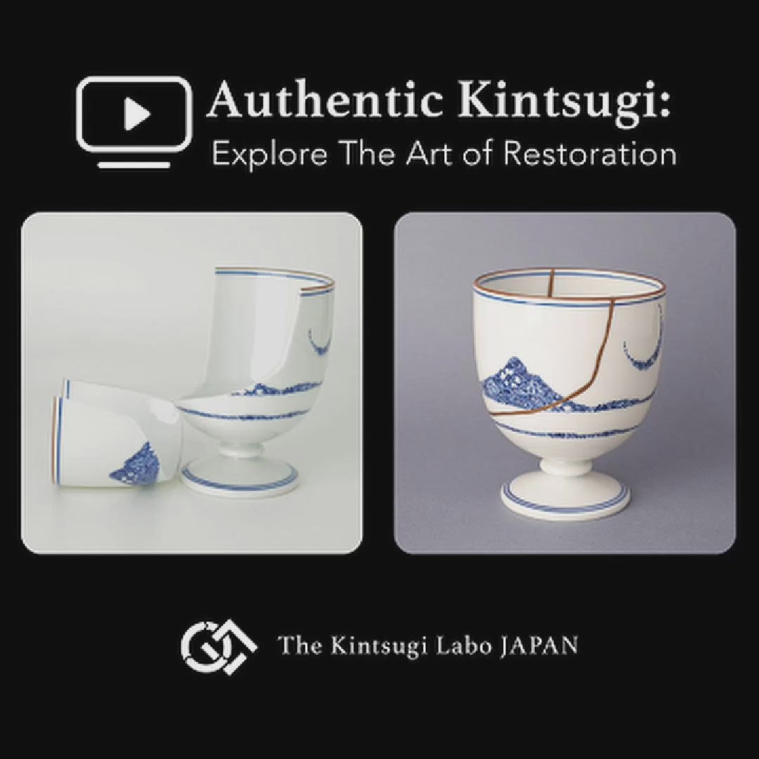 A lacquer artist restoring an Arita ware sake cup in white porcelain with 100% natural urushi and 24K gold, showing the kintsugi restoration process in the studio.