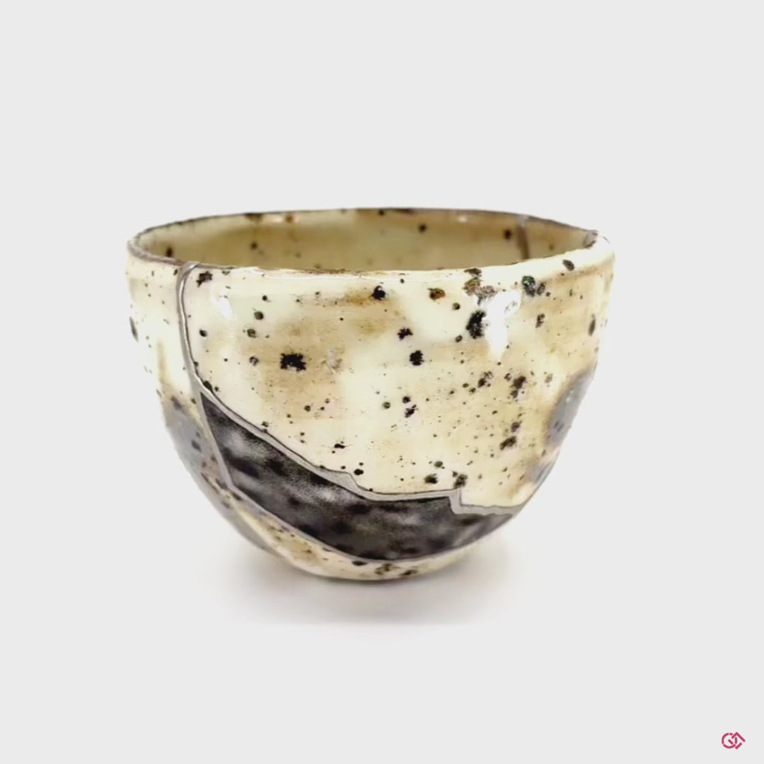 Witness the transformation: Rotating video of broken pottery reborn through Kintsugi.