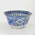 Rotating video of the octagonal Ko-Imari kintsugi bowl, blue-and-white porcelain turning to reveal green urushi and raden panels, 24K gold outlines and pure silver seams from every side.