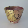 A 360-degree video of the mixed-media kintsugi cup, showcasing its visible resilience and the harmony of its complex, artistic repair.