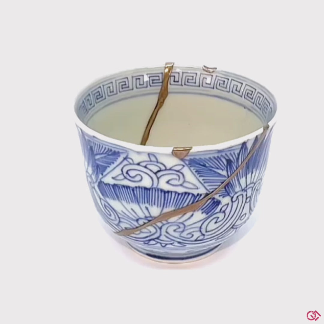 A rotating video of an authentic Kintsugi pottery piece, allowing viewers to see the piece from all angles.