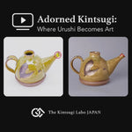 Restoration-story video of a Kyoto ware sake carafe whose chipped spout is drawn back as a plum blossom in 24K gold, pure silver, and colored urushi over four months.