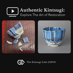 A lacquer artist restoring a Ko-Imari sake cup with natural urushi and 24K gold, showing the kintsugi process in the studio.