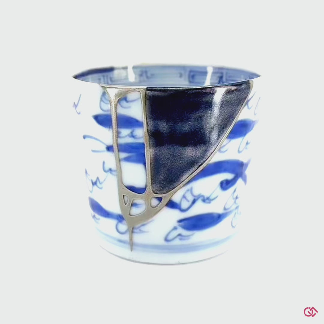 Witness the transformation: Rotating video of broken pottery reborn through Kintsugi.