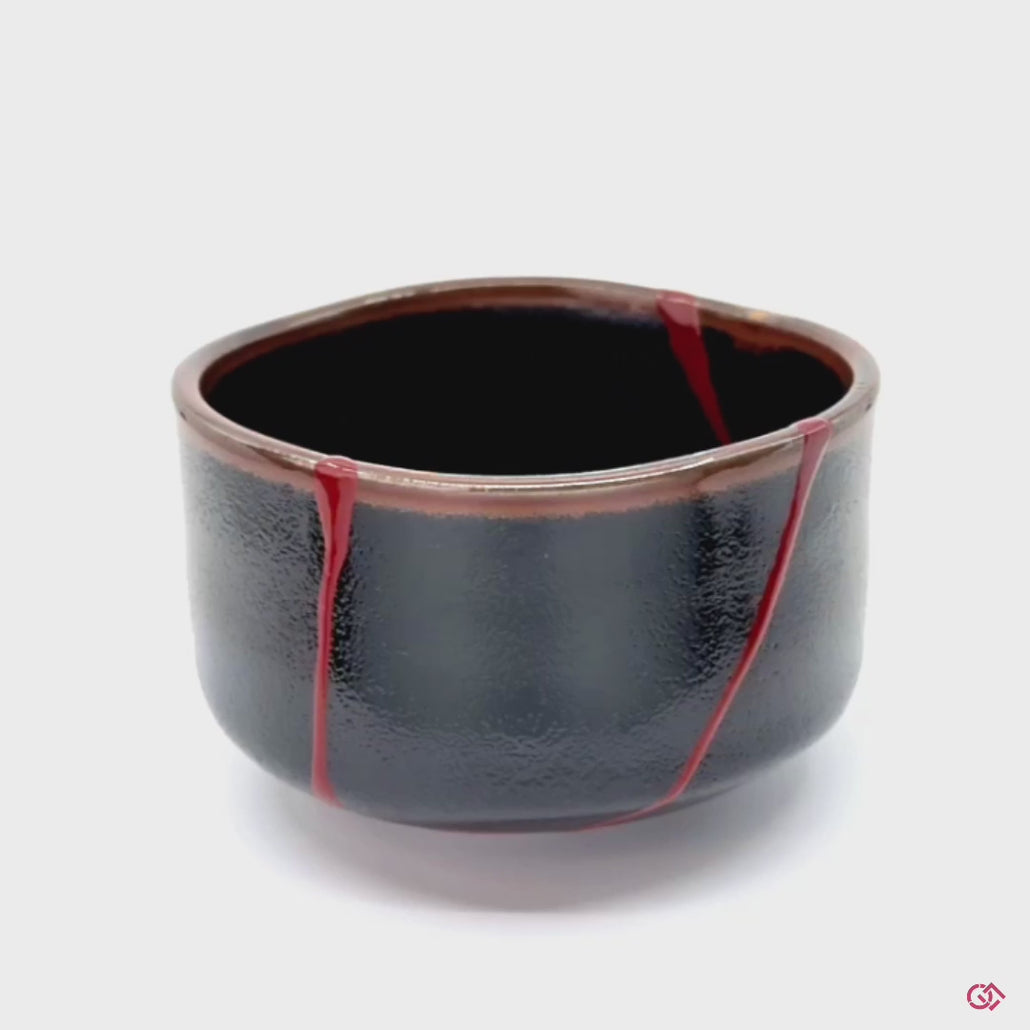 Witness the transformation: Rotating video of broken pottery reborn through authentic kintsugi technique.