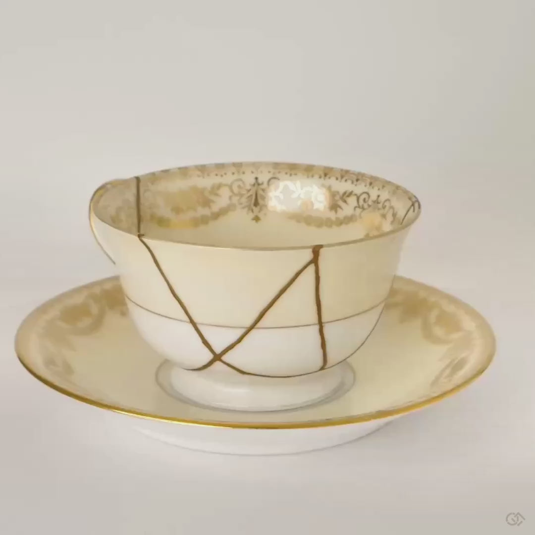 This Noritake kintsugi cup turns slowly, revealing 24K gold seams that map its story of enduring grace.