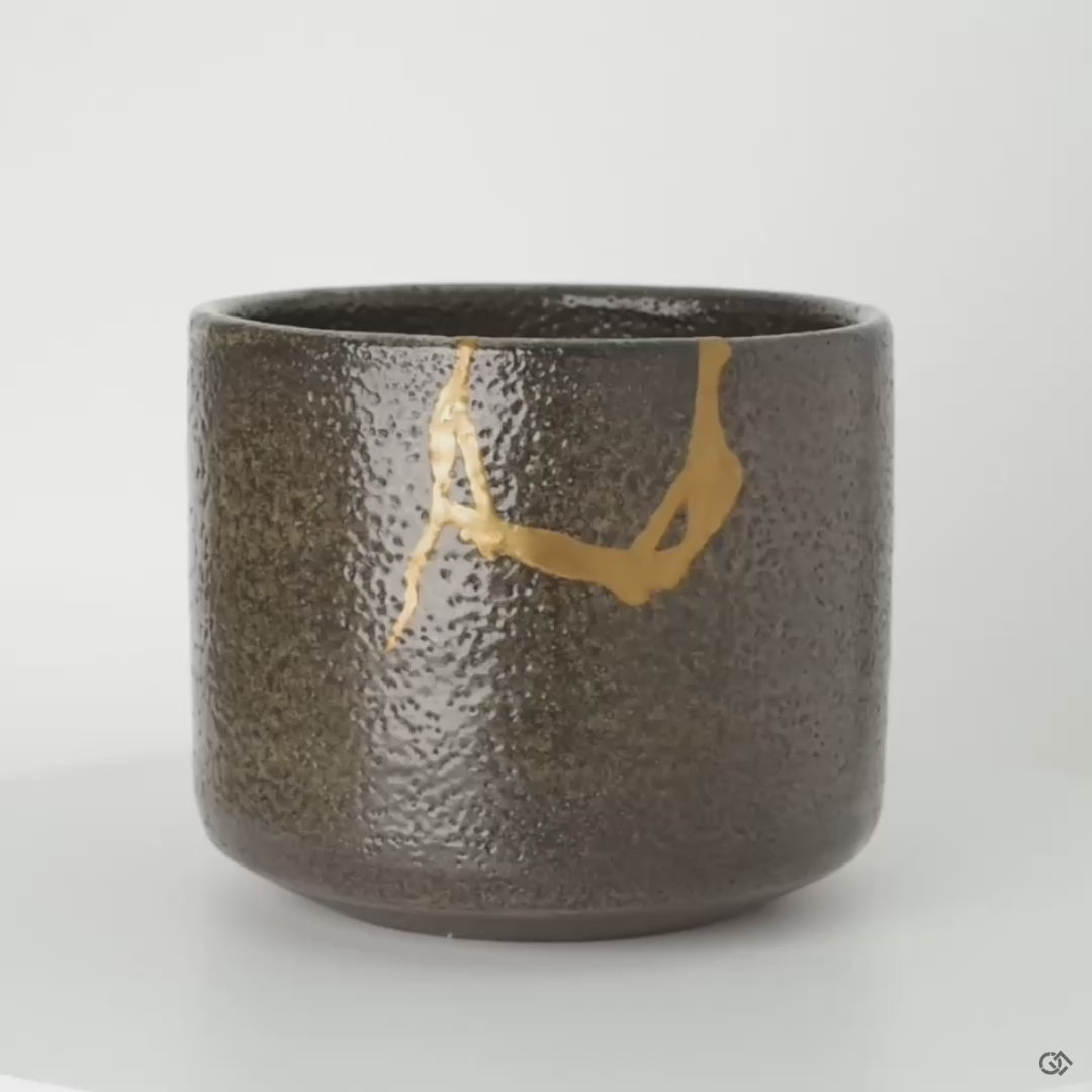 Rotating view of kintsugi matcha bowl showing gold seams from all angles, a treasured heirloom in motion.