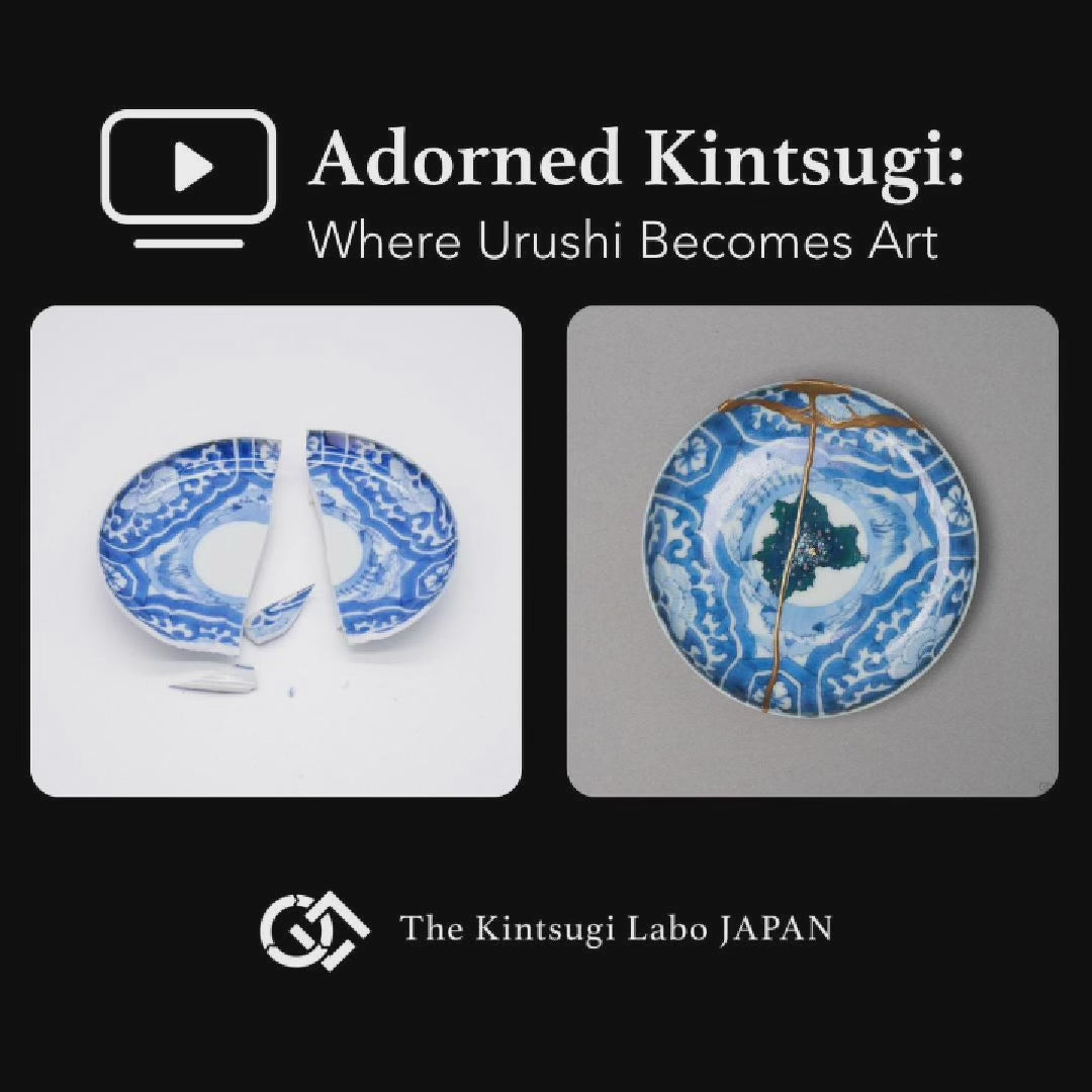 Work-scene video of a Ko-Imari sometsuke plate being restored by kintsugi with natural urushi and 24K gold, showing the lacquer process in the studio.