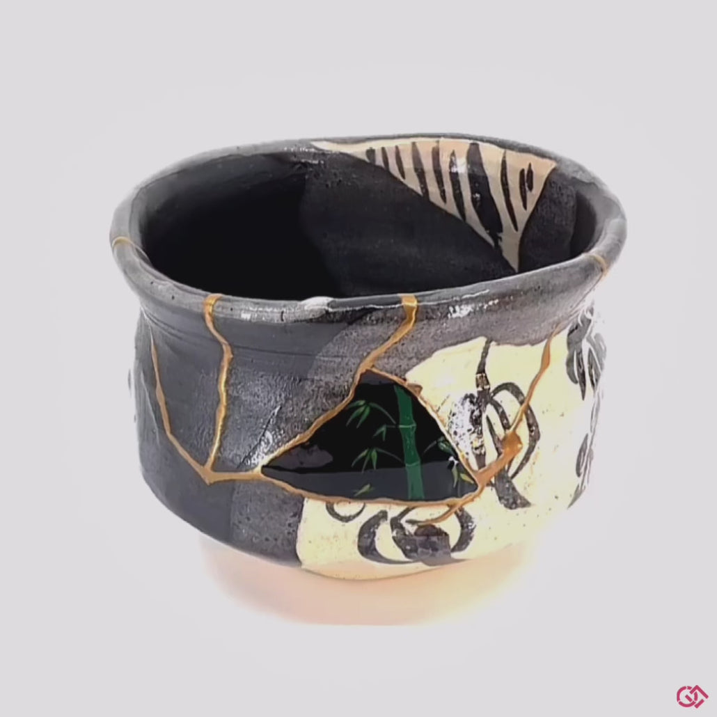 A rotating video of an authentic Kintsugi pottery piece, allowing viewers to see the piece from all angles.