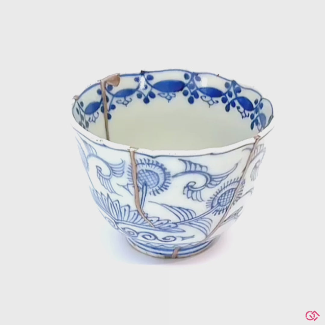 A rotating video of an authentic Kintsugi pottery piece, allowing viewers to see the piece from all angles.