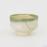 A 360-degree rotation of this kintsugi matcha bowl, the gold seam turning into view against green-rimmed earthenware, a one-of-a-kind piece.