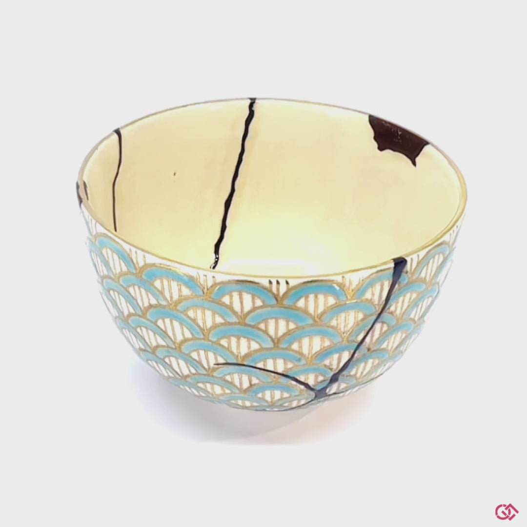 A rotating video of an authentic Kintsugi pottery piece, allowing viewers to see the piece from all angles.
