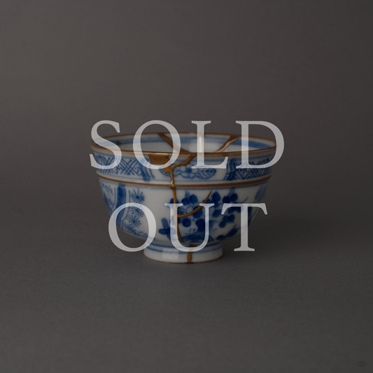Sold out: 24K gold kintsugi Ko-Imari sometsuke cup with gold seams across blue-and-white porcelain, restored with natural urushi lacquer.